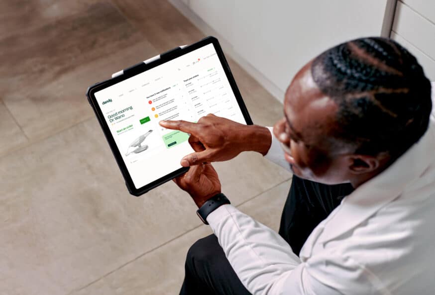 Dandy doctor using application on tablet